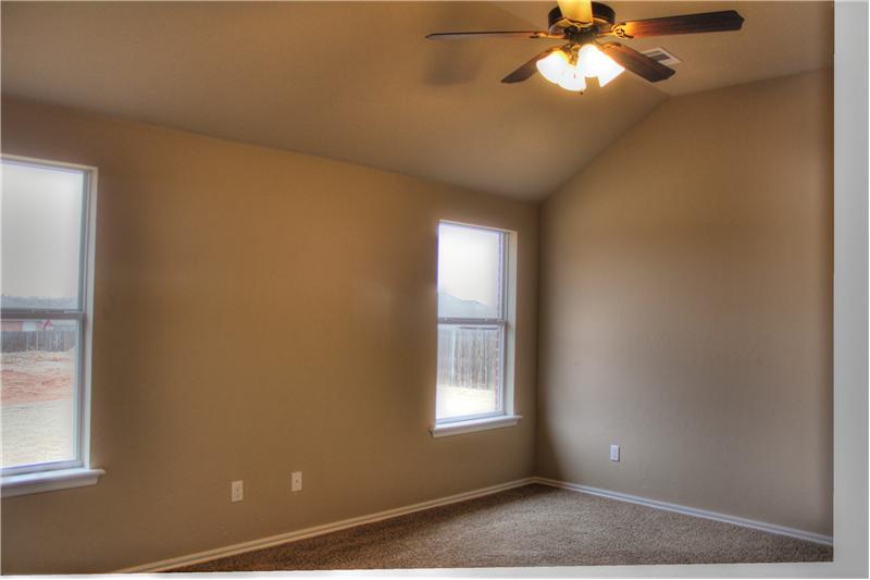 Master Bedroom with slanted tall ceiling