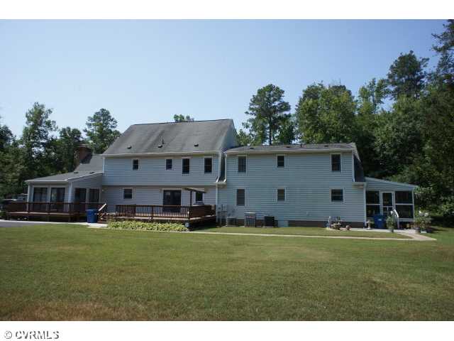 Backyard view of the home. Right side features screened porch to Mother-In-Law Suite/Second Home.
