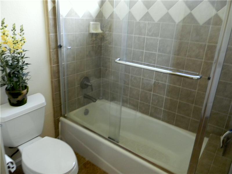 Shower, tub and toilet area