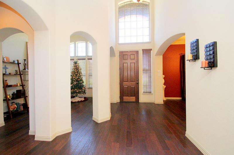 Beautiful two story entry with hardwood floors.