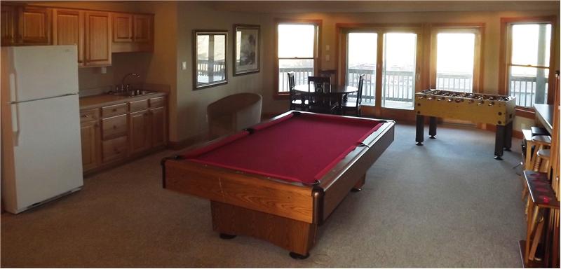 with a wet bar & pool table.