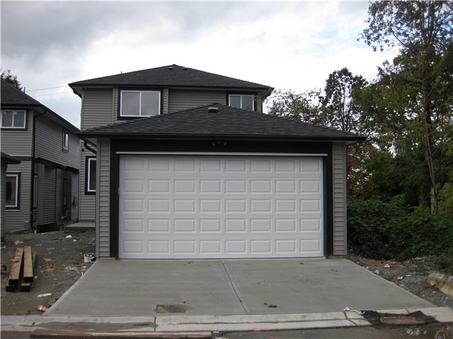 Detached  double garage with garage door opener